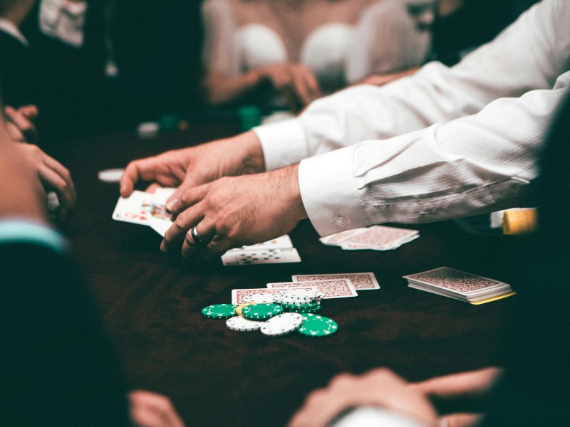 poker game with cards and chips and dealer
