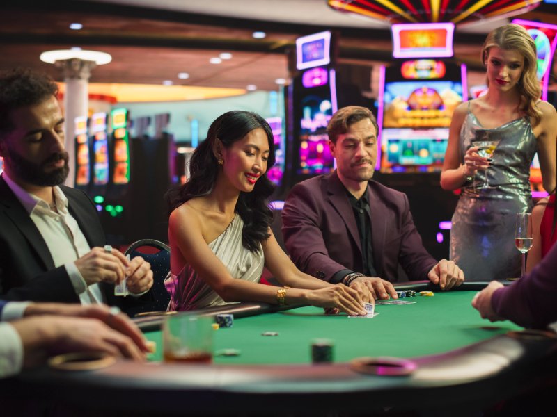 people in a casino playing poker